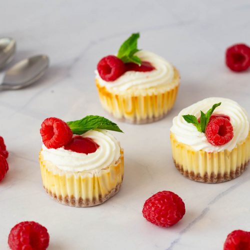 Baked mini cheesecakes on the table.