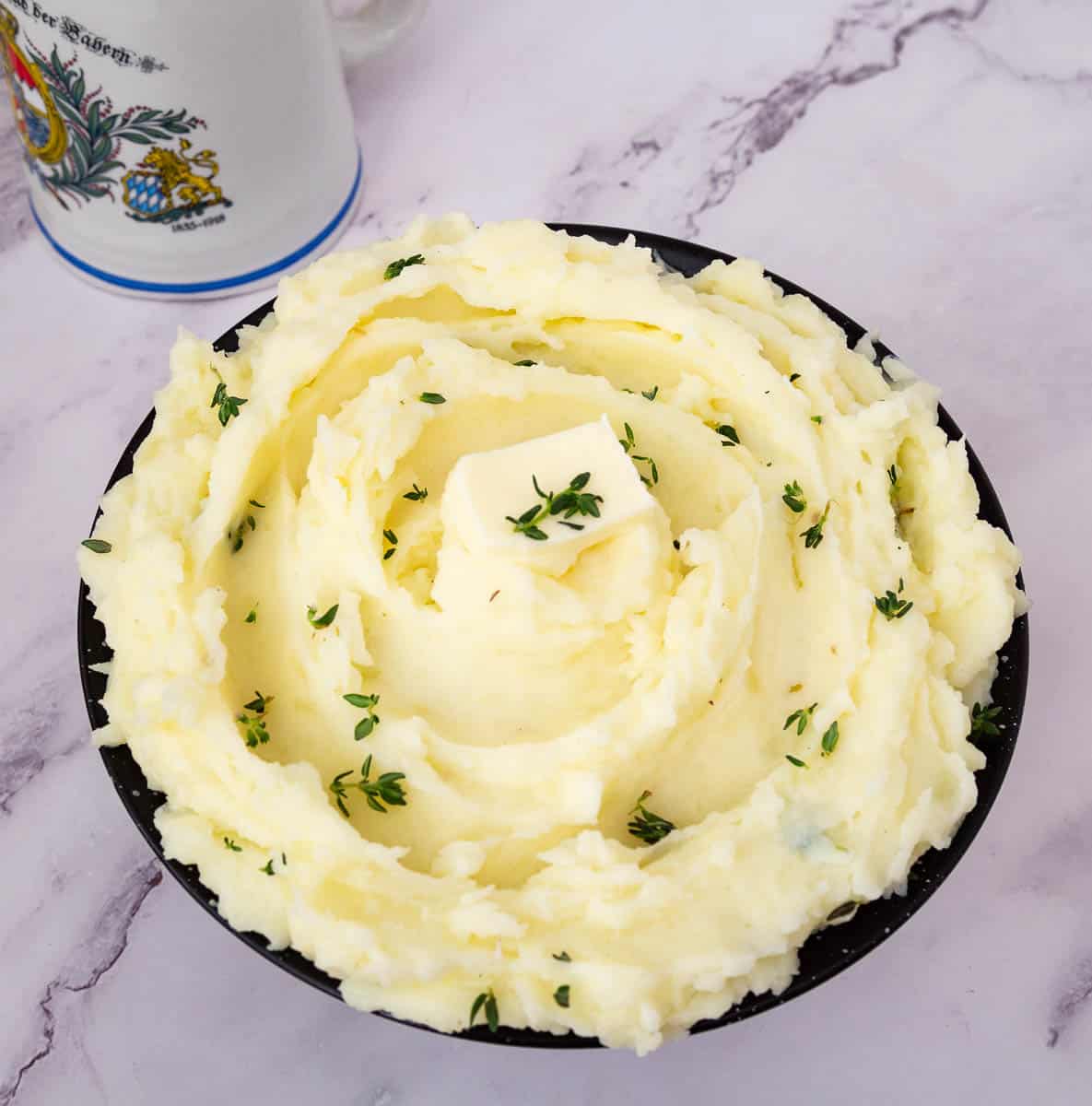 A bowl with potatoes - mashed.