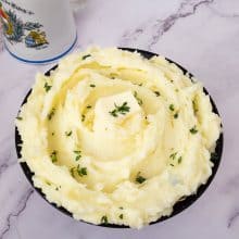 A bowl filled with side dish - potatoes.