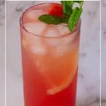 A tall glass with juice made watermelon and lemon.
