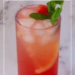 A tall glass with juice made watermelon and lemon.