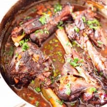 Shanks of lamb in a Dutch oven.