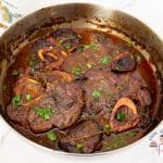 A pan with braised osso bucco.