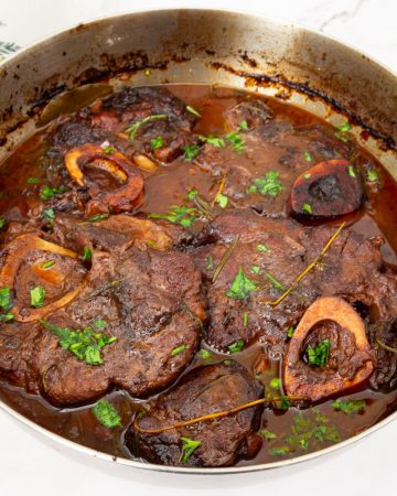 A pan with braised osso bucco.