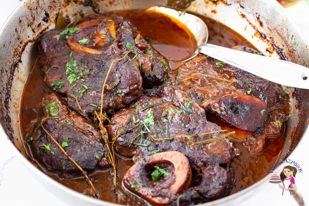 Ossobucco in a pan slow cooked till fork tender.