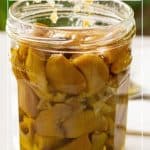 Pinterest image for garlic roasted in the oven.