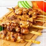 Pinterest image for chicken on skewers with peanut sauce,