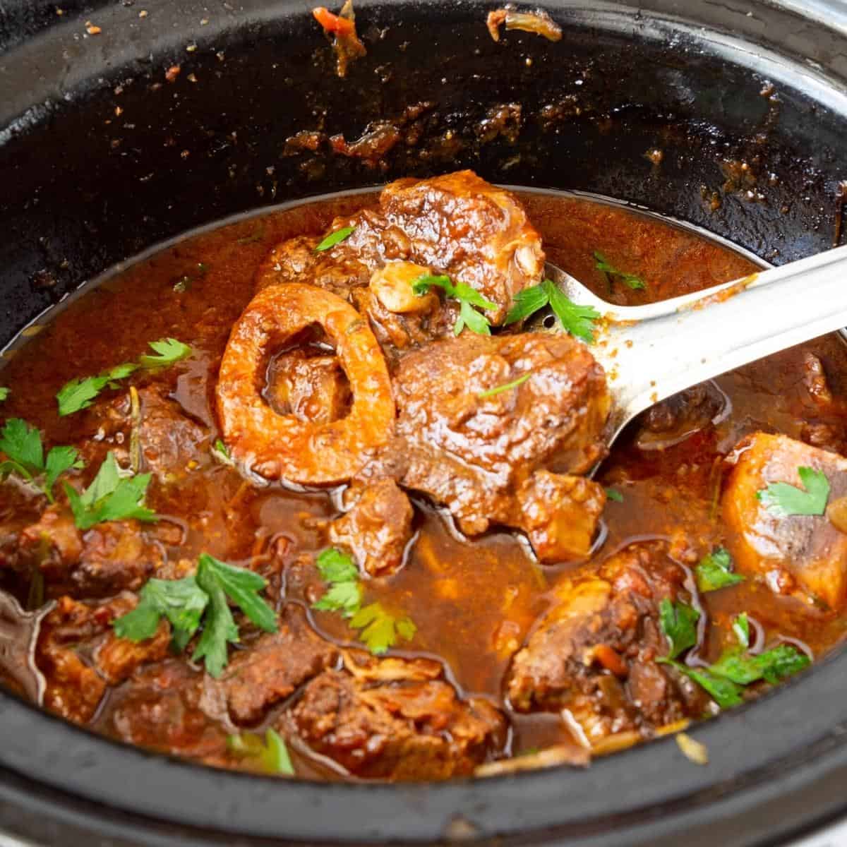 A slow cooker with shanks.