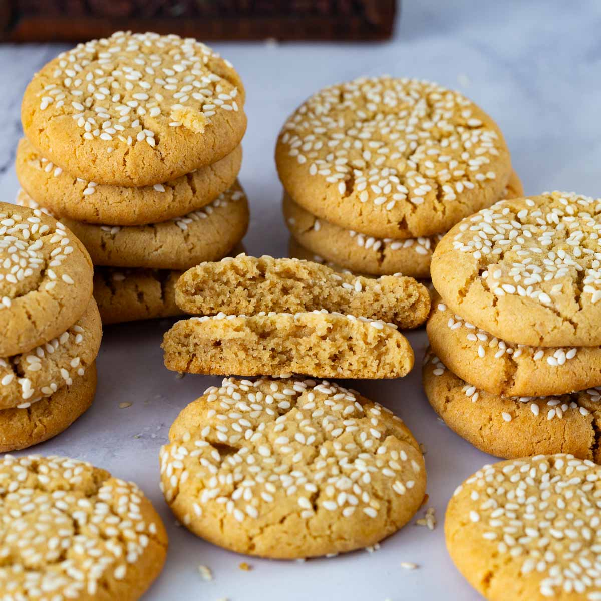 Broken sesame cookie showing the inside.