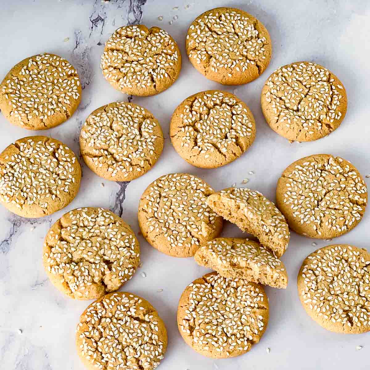 Sesame topped tahini cookies on the table.