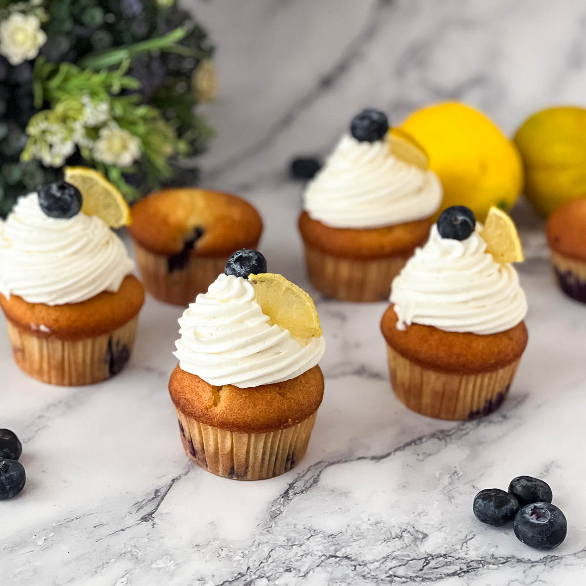 Frosted cupcakes with lemon and blueberry.
