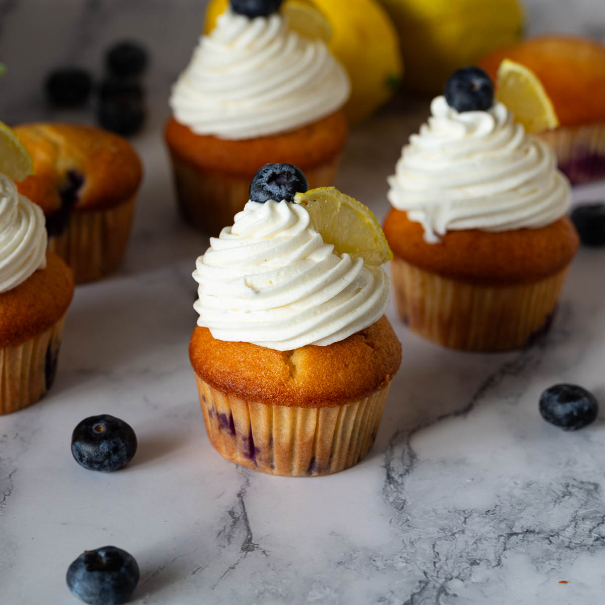 Frosted lemon blueberry cupcakes.