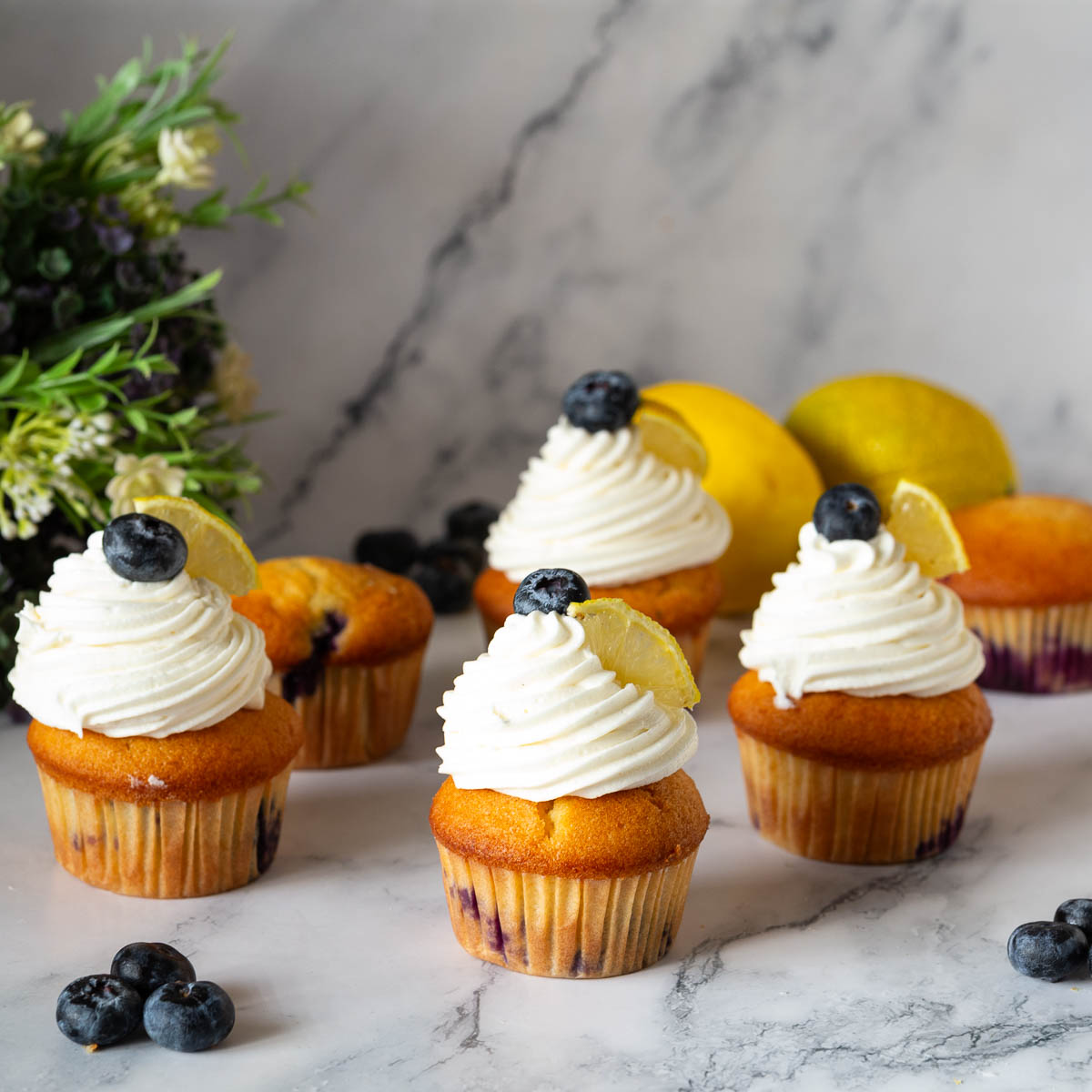 Frosted cupcakes with cream cheese frosting.