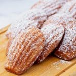 Madeleines on a wooden board.