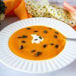 A soup bowl with pumpkin soup.
