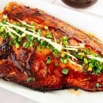 A salmon fillet with teriyaki sauce.