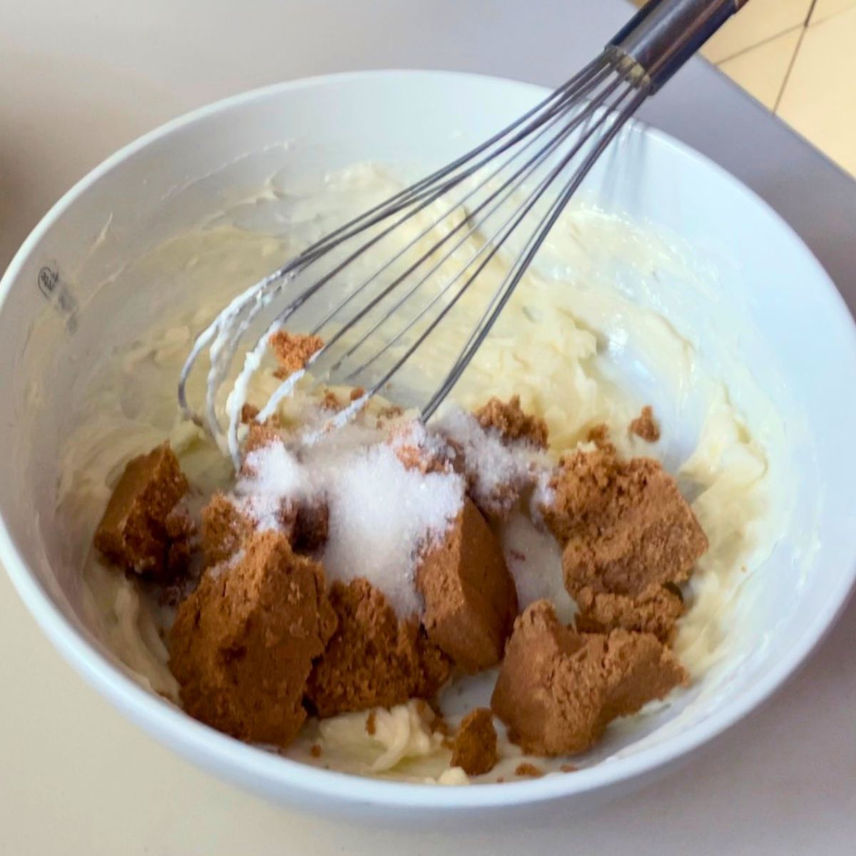 Cream butter and sugar in a bowl.