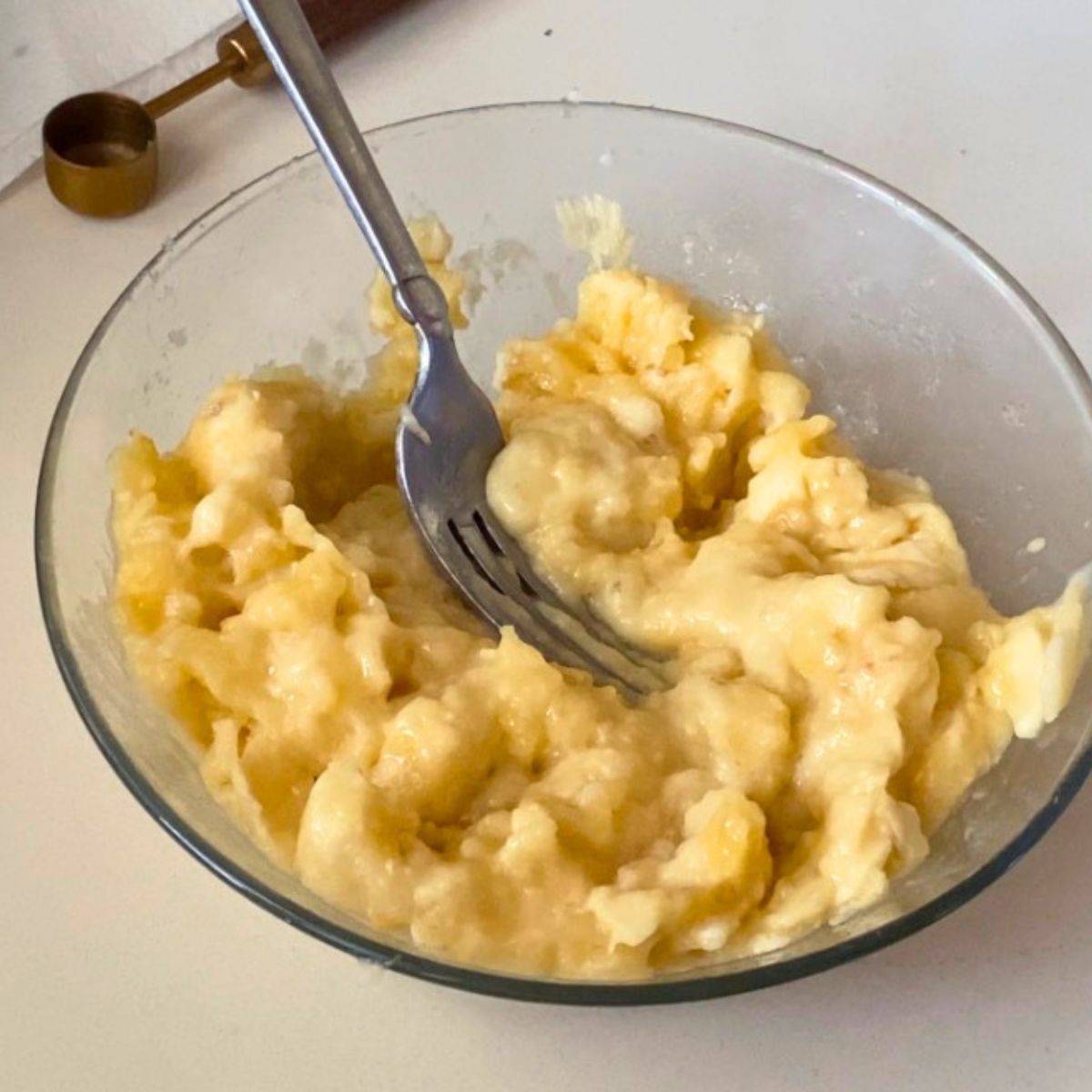 A bowl with mashed banana.
