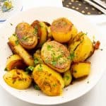 Cooked potatoes in a serving dish.