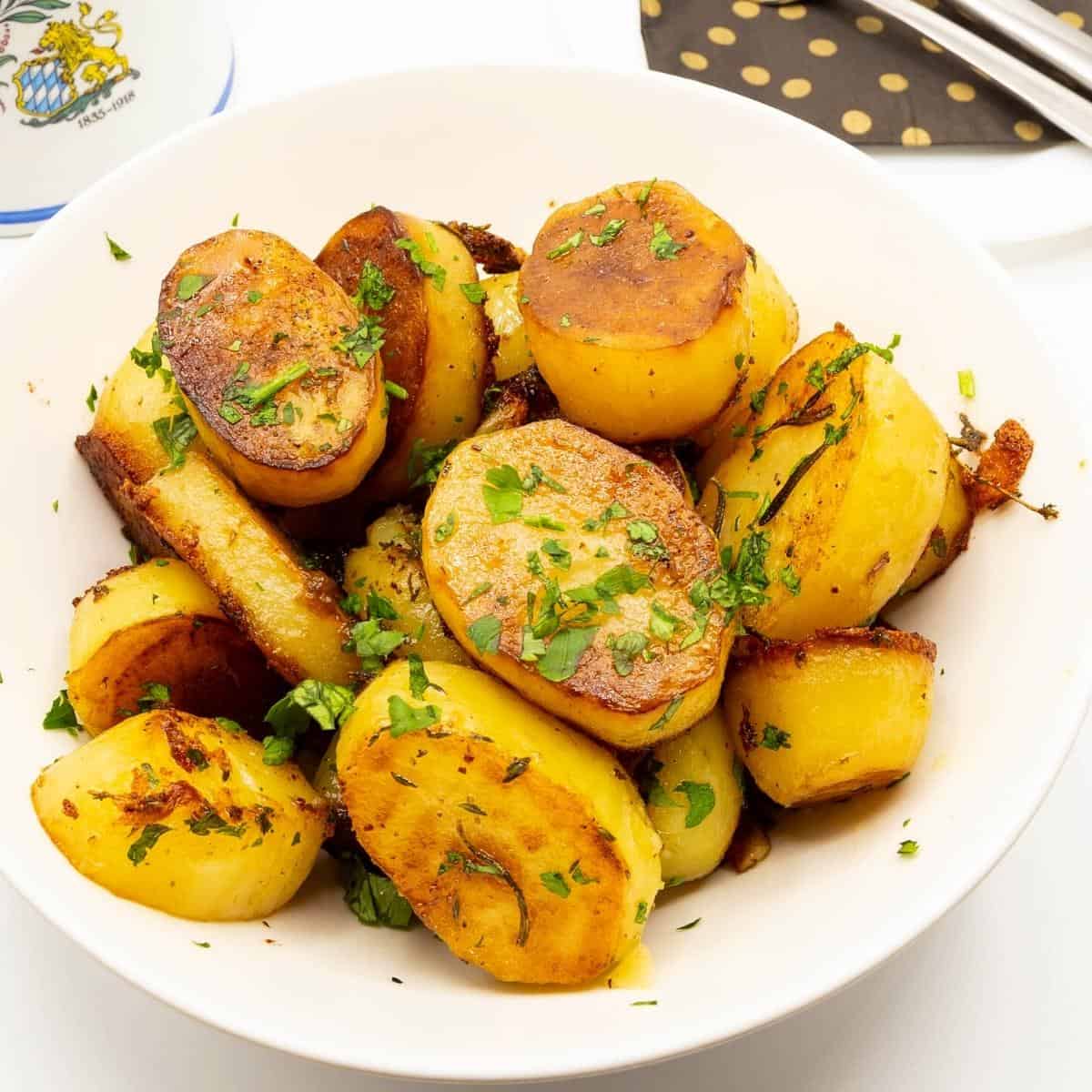 Cooked potatoes in a serving dish. 