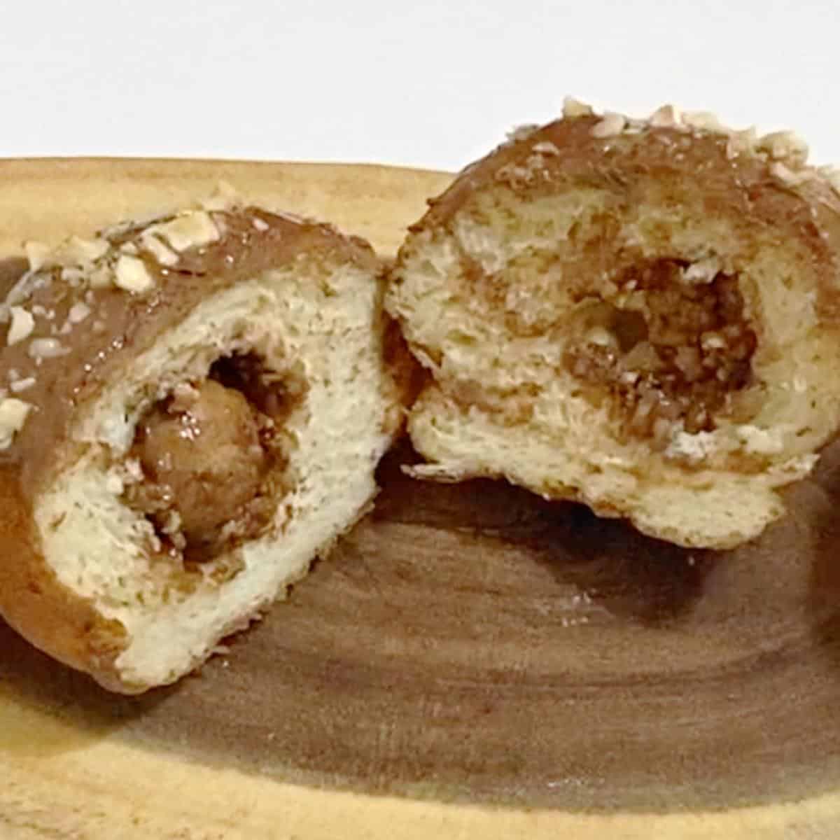 A sliced donut with ferro rocher.