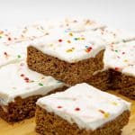 Gingerbread cookie bars on a wooden board.