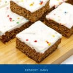 Pinterest image for Gingerbread bars on a wooden board.