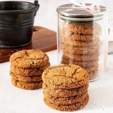 Stack of ginger cookies and a jar.