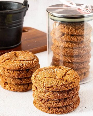 Stack of ginger cookies and a jar.