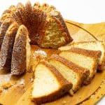 Marzipan cake and slices on a table.
