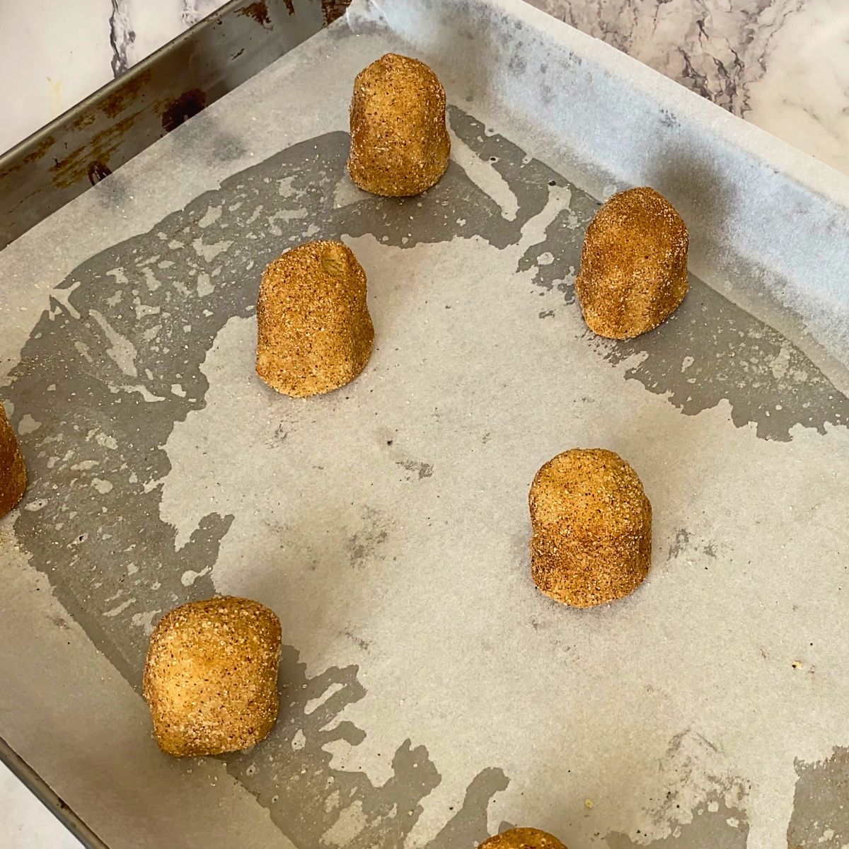 Place the cookie dough balls on a baking sheet.