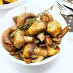 A bowl with sautéed mushrooms.