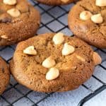 Cookie with peanut butter chip on wire rack.