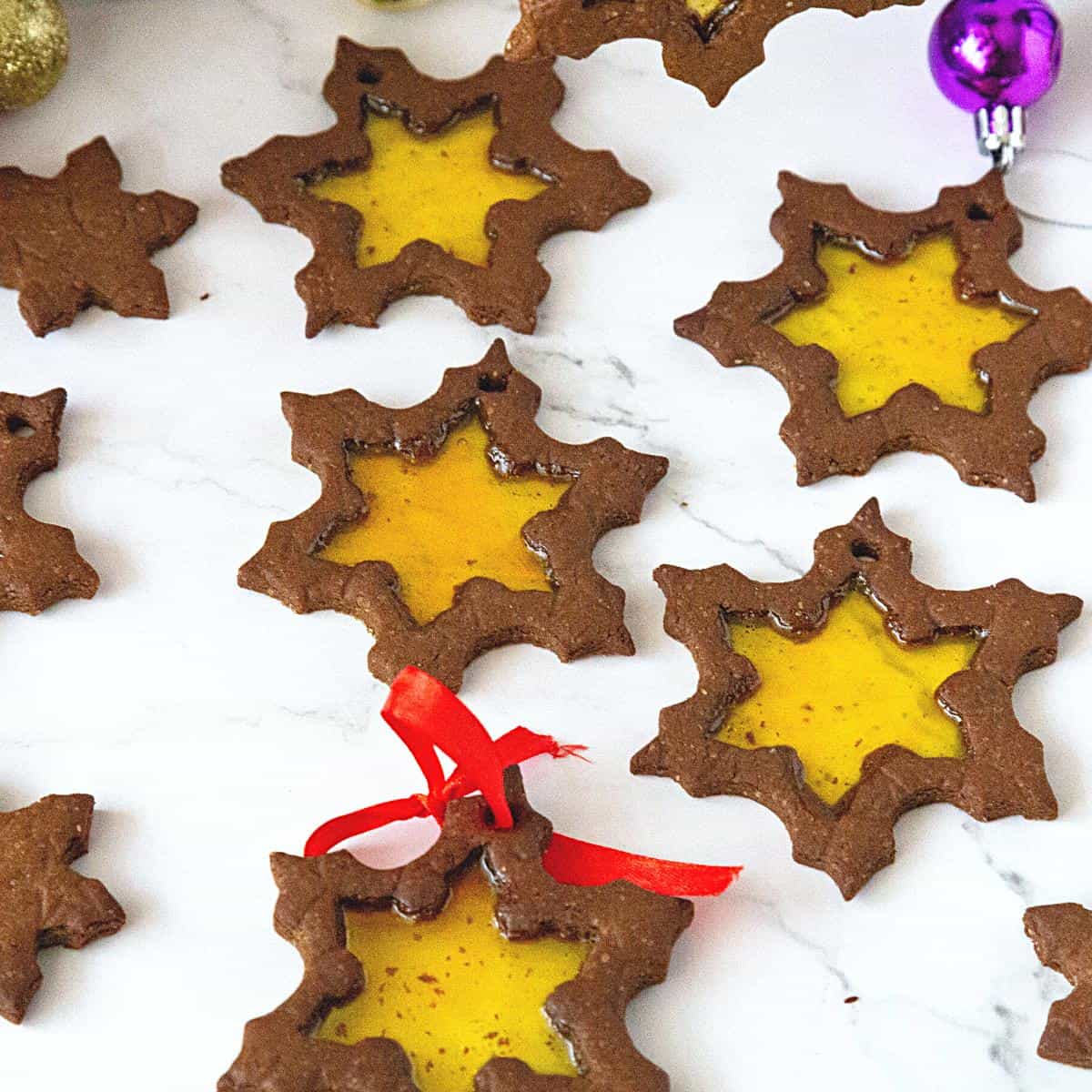 https://veenaazmanov.com/wp-content/uploads/2021/12/Snowflake-Stained-Glass-Cookies-Recipe3.jpg