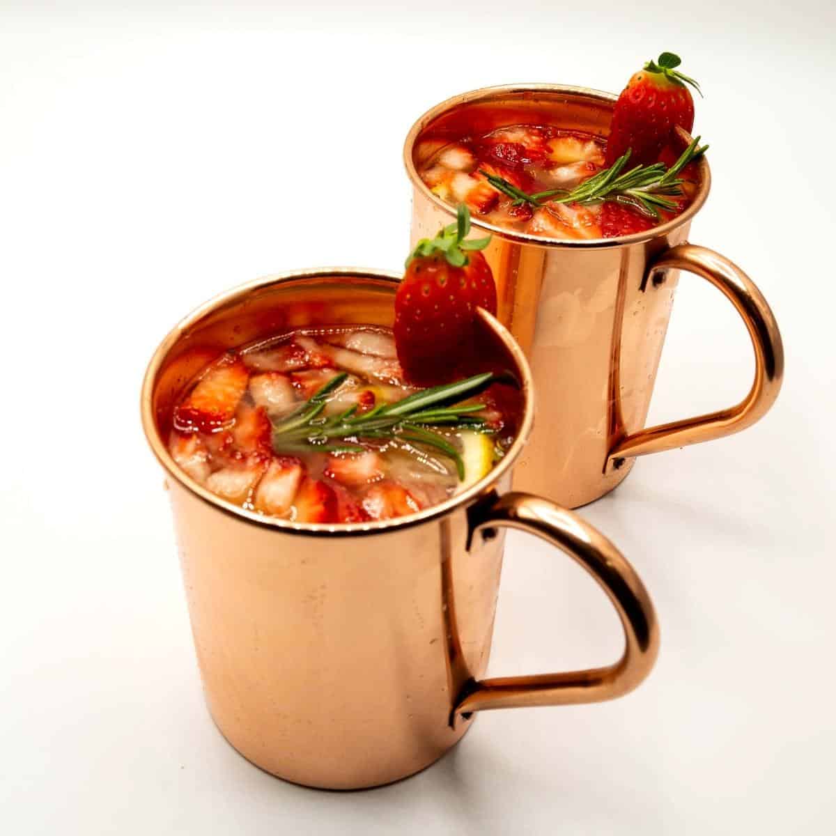 Two copper mugs with mule cocktails.