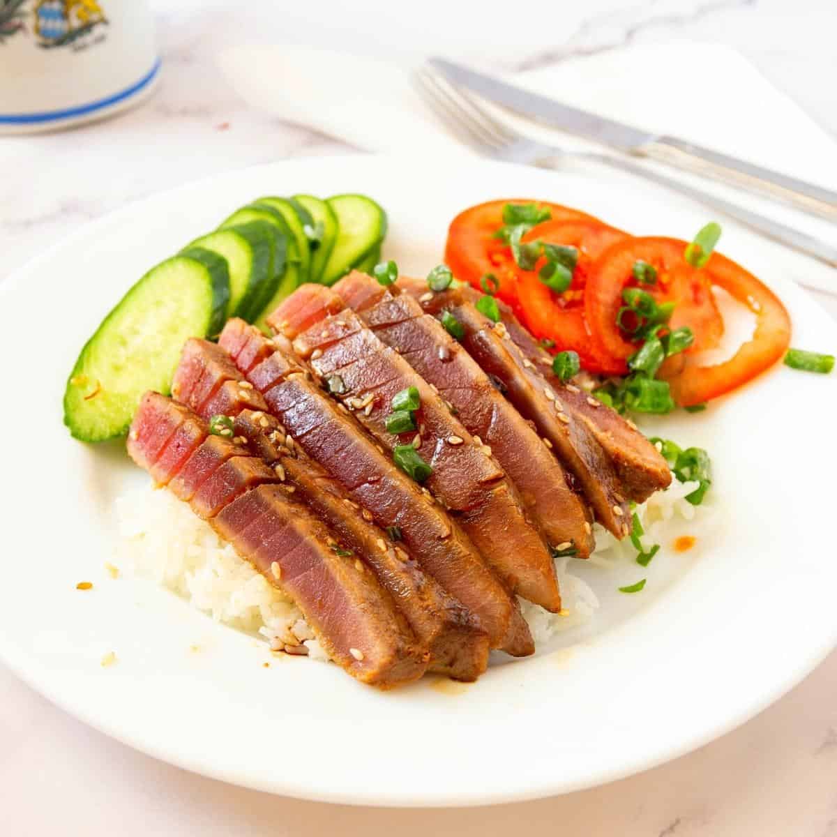 Sliced tuna steak on the plate.