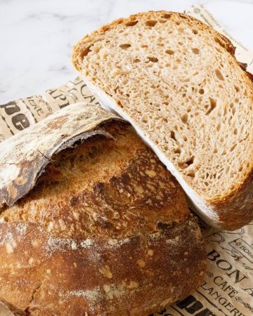 A cut loaf of sourdough bread.