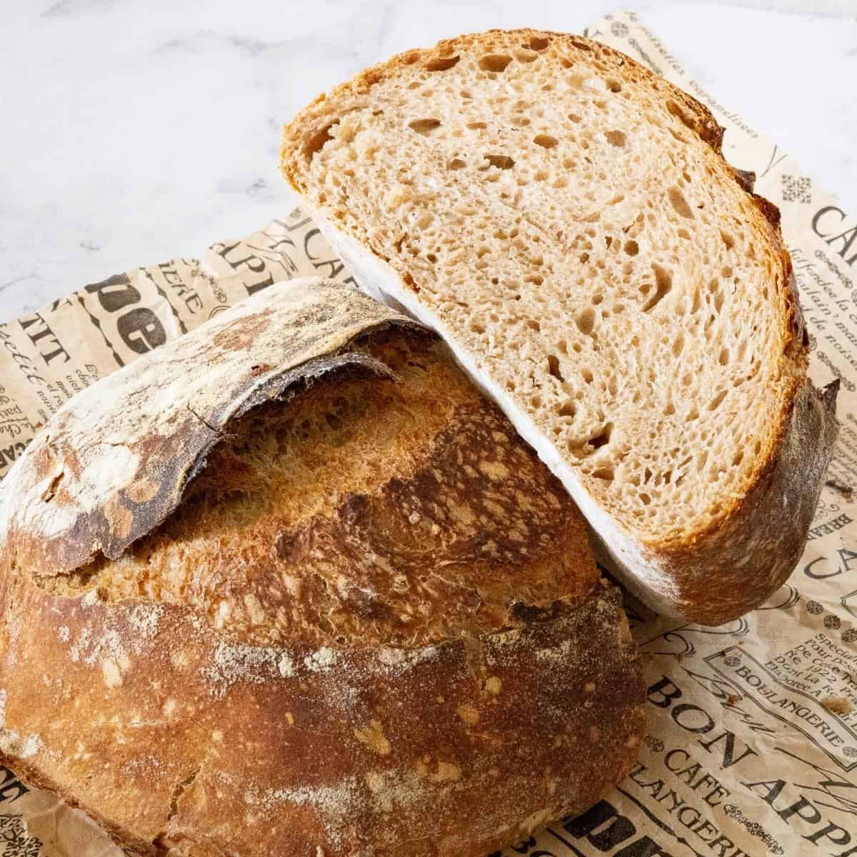 A cut loaf of sourdough bread.