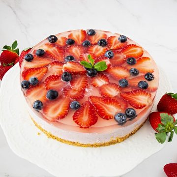 A strawberry topped mousse cake.