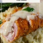 Pinterest image for cordon bleu chicken with cheese sauce.