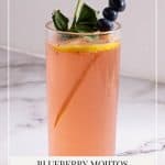 Pinterest image - A cocktail glass with mojitos with fresh blueberries.