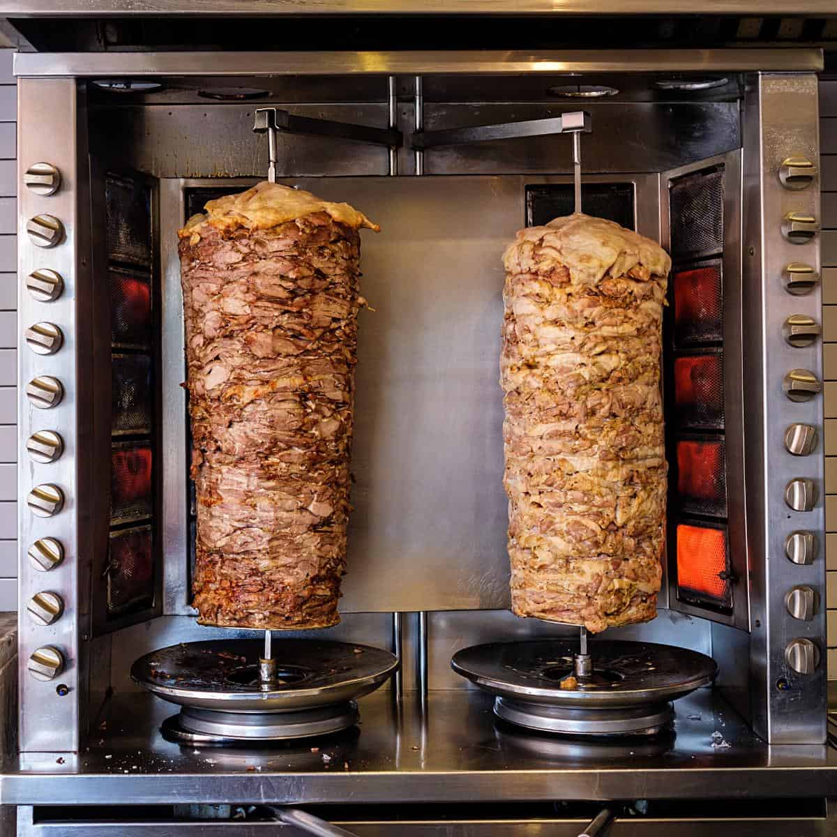 Two sticks of shawarma rotisserie. 