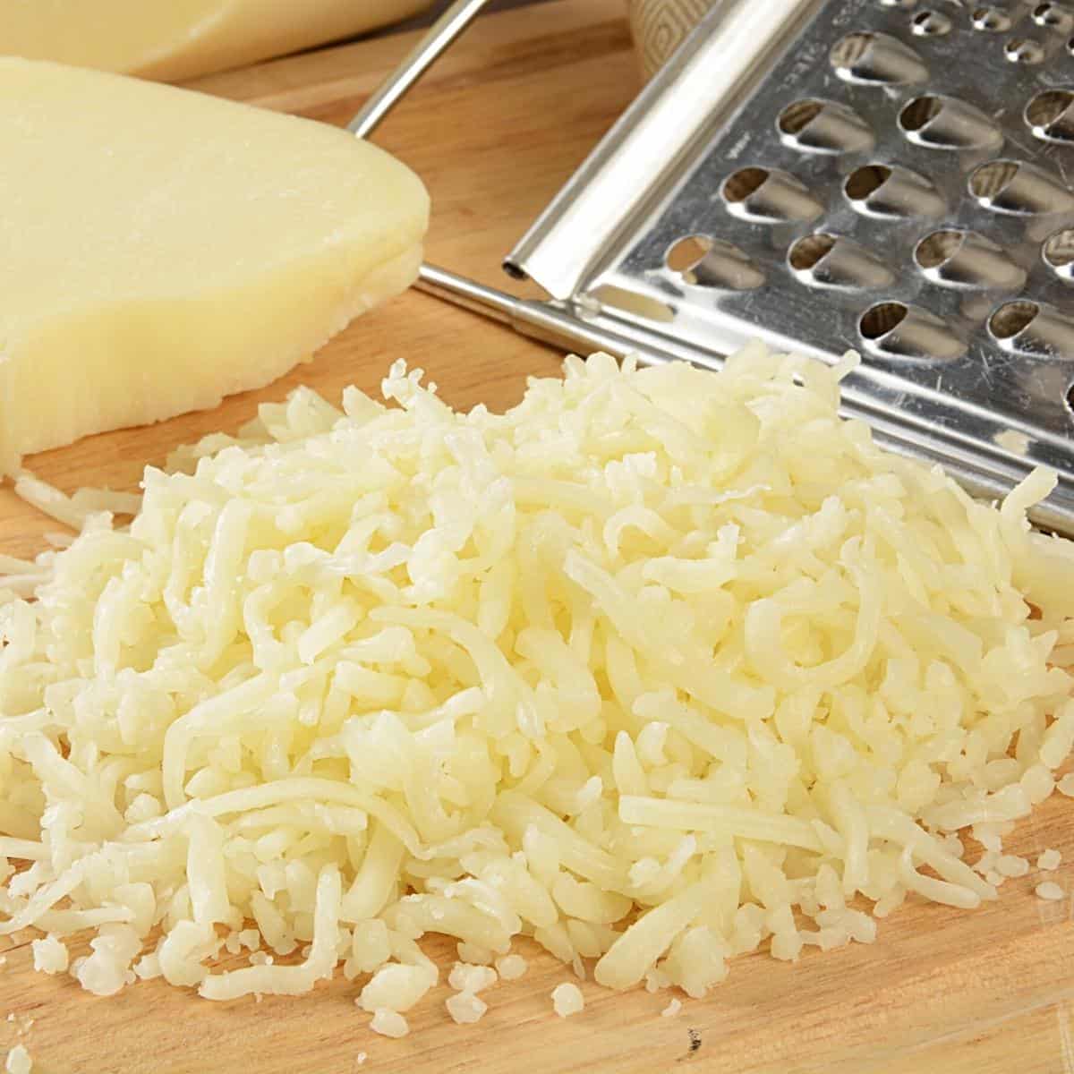 Grated cheese on a board.