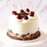 A frosted cake on the table.