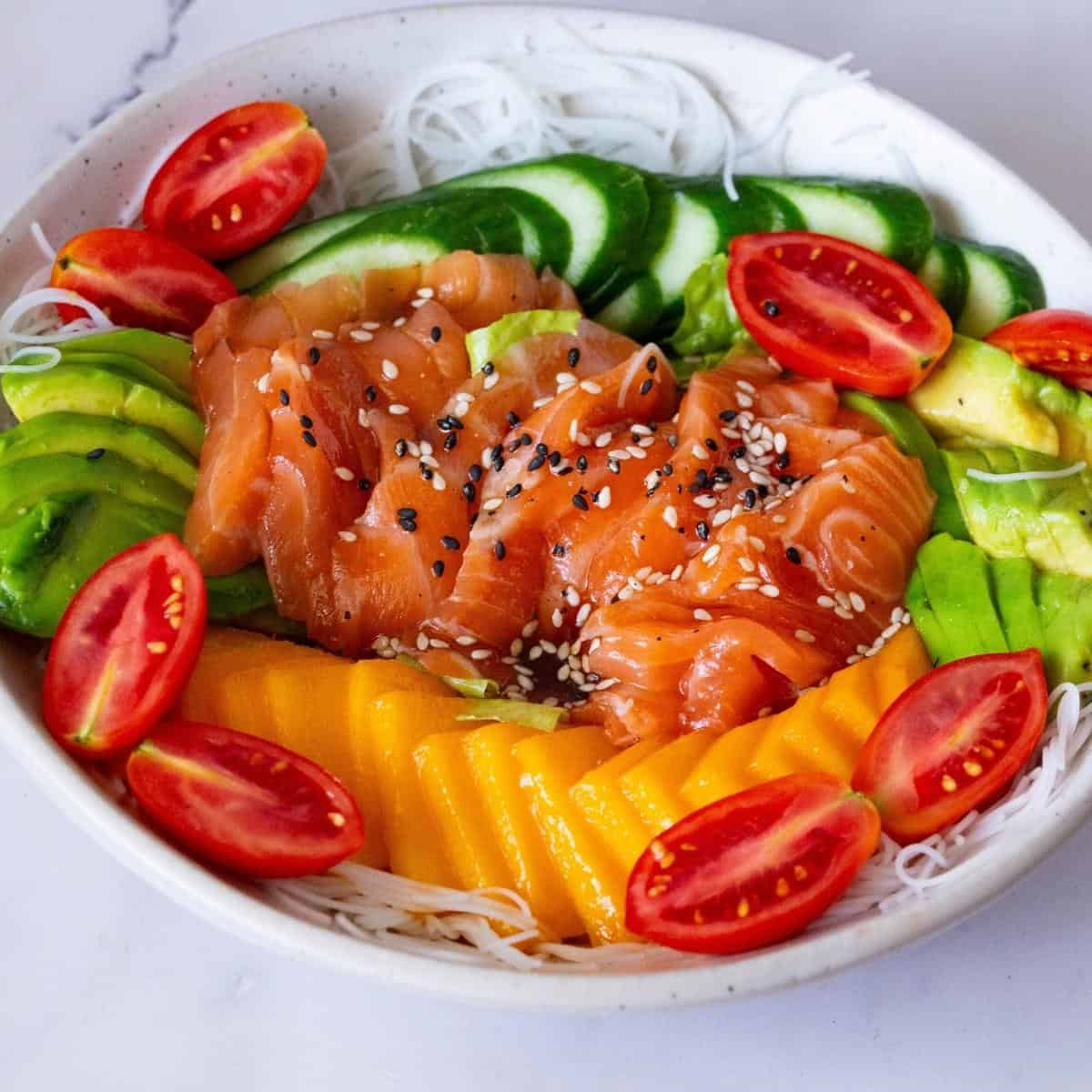 A white bowl with fresh salmon poke.