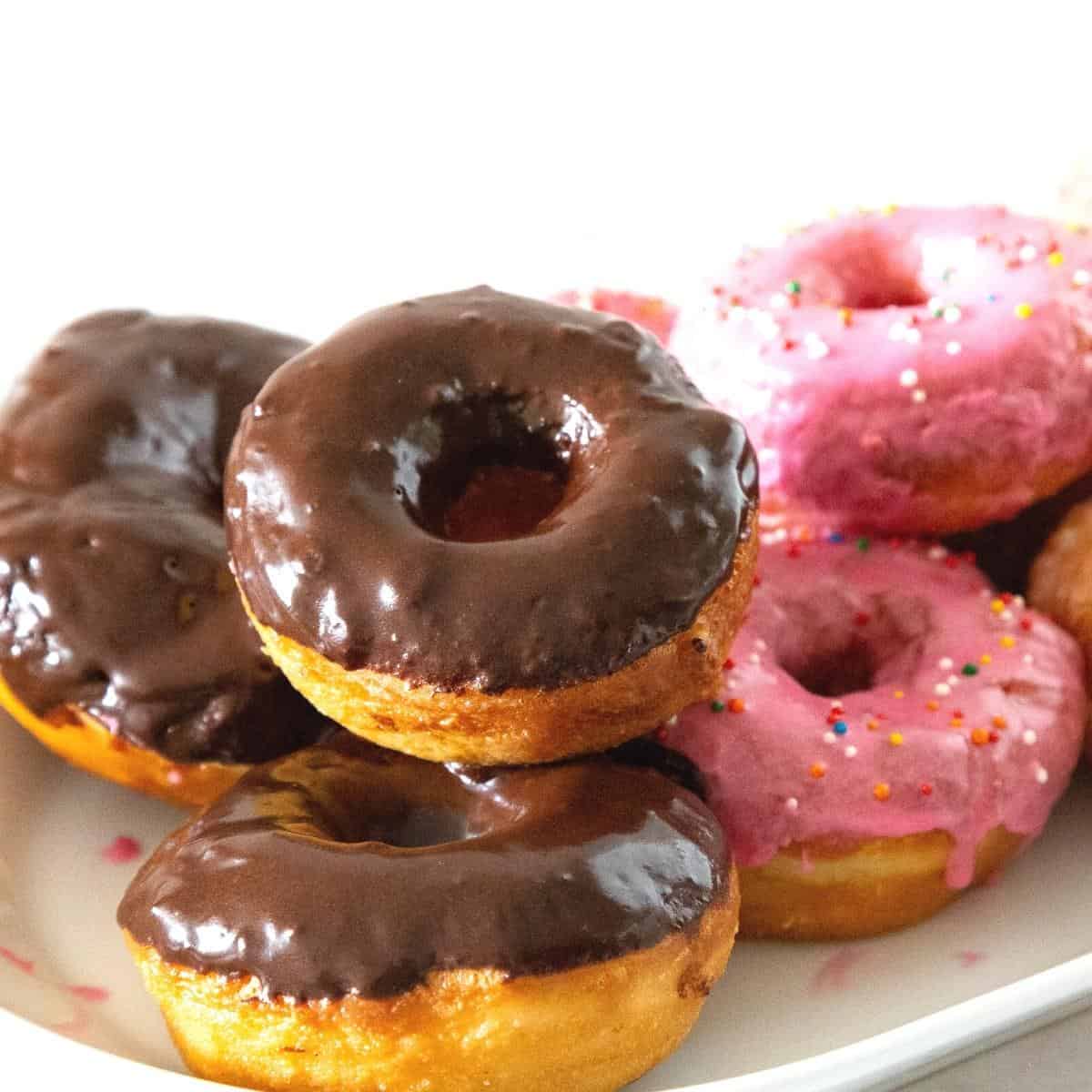 A tray with chocolate glazed donuts.