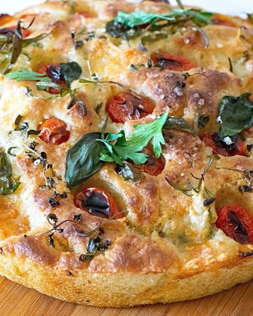 A focaccia baked with cherry tomatoes.