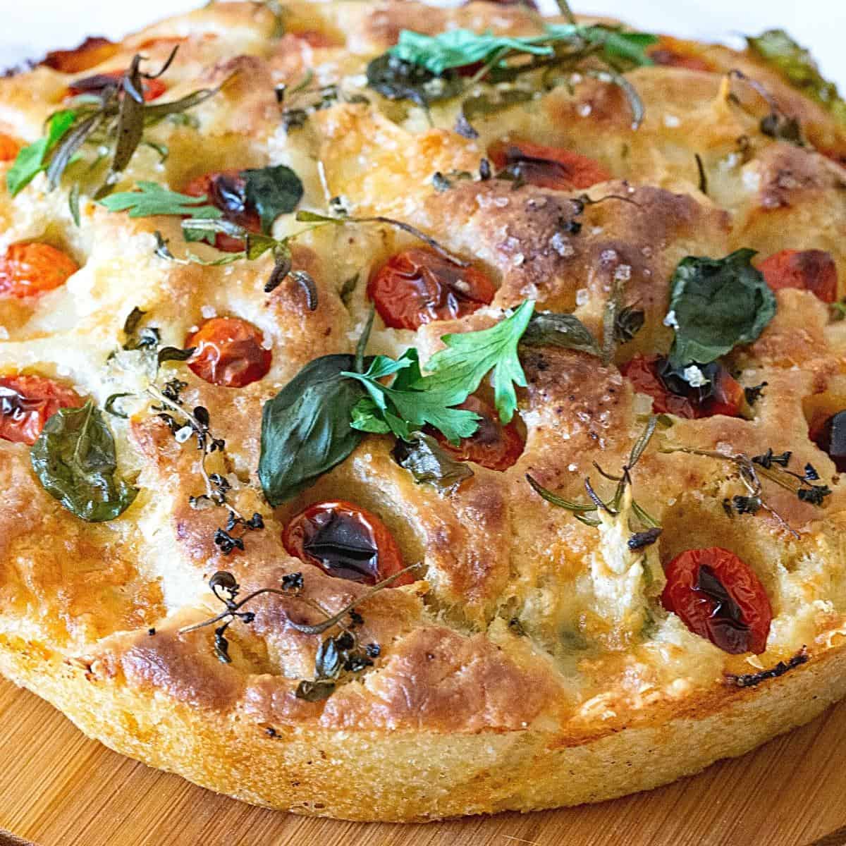 A focaccia baked with cherry tomatoes.
