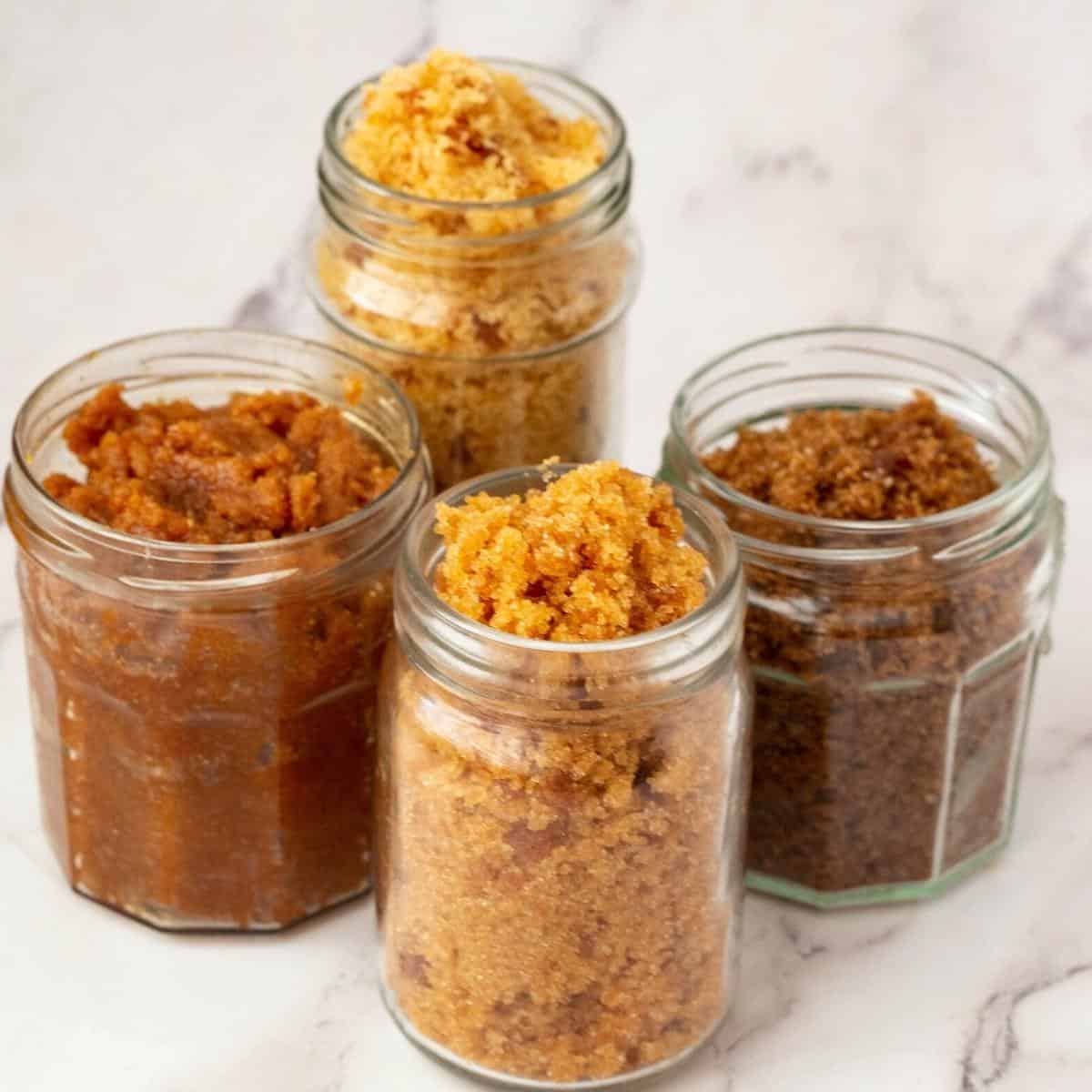 Four jars with brown sugar.