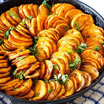 A skillet with sweet potato slices.